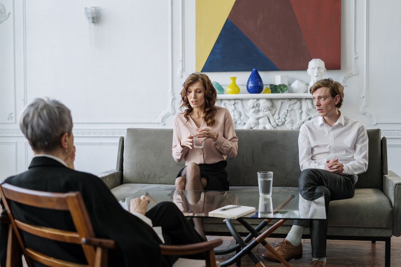 Two adults in a consultation conversation with an advisor — the next step once you’ve confirmed this profile fits your situation.