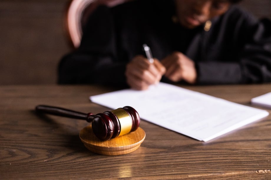 Gavel resting on a signed court document
