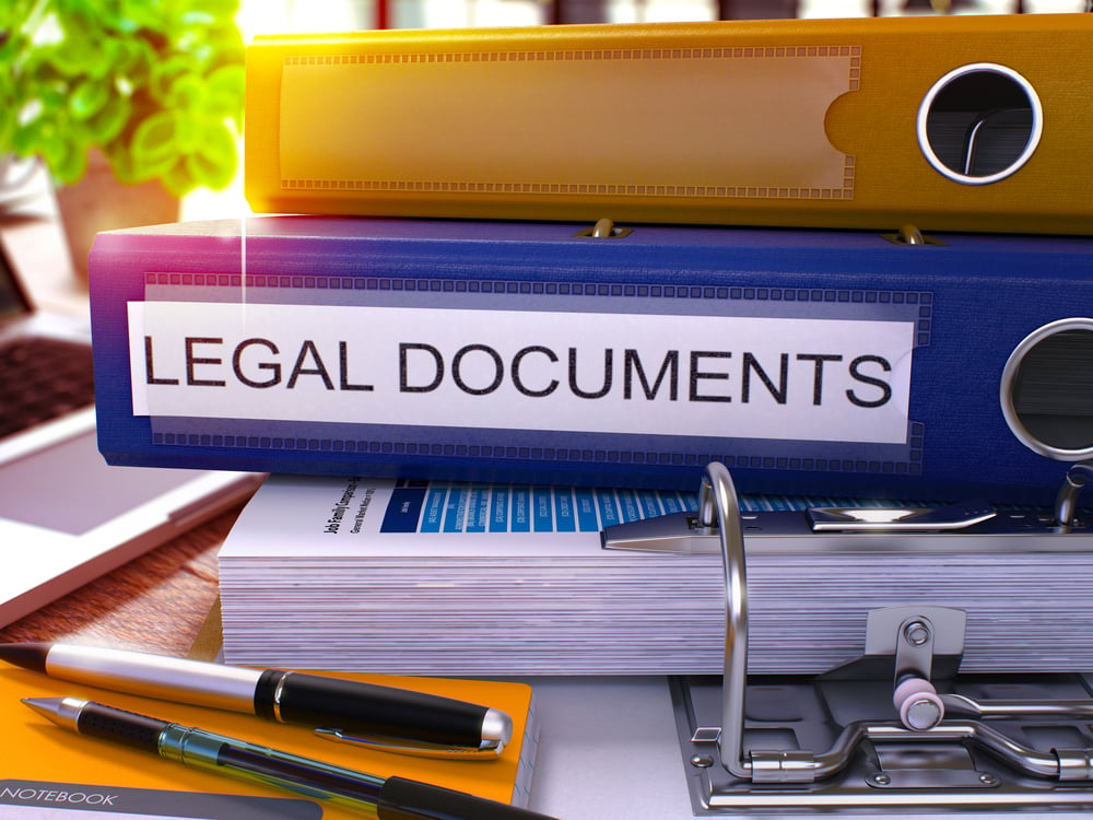 Blue Office Folder with Inscription Legal Documents on Office Desktop with Office Supplies and Modern Laptop. Legal Documents Business Concept on Blurred Background. Legal Documents - Toned Image. 3D.-1